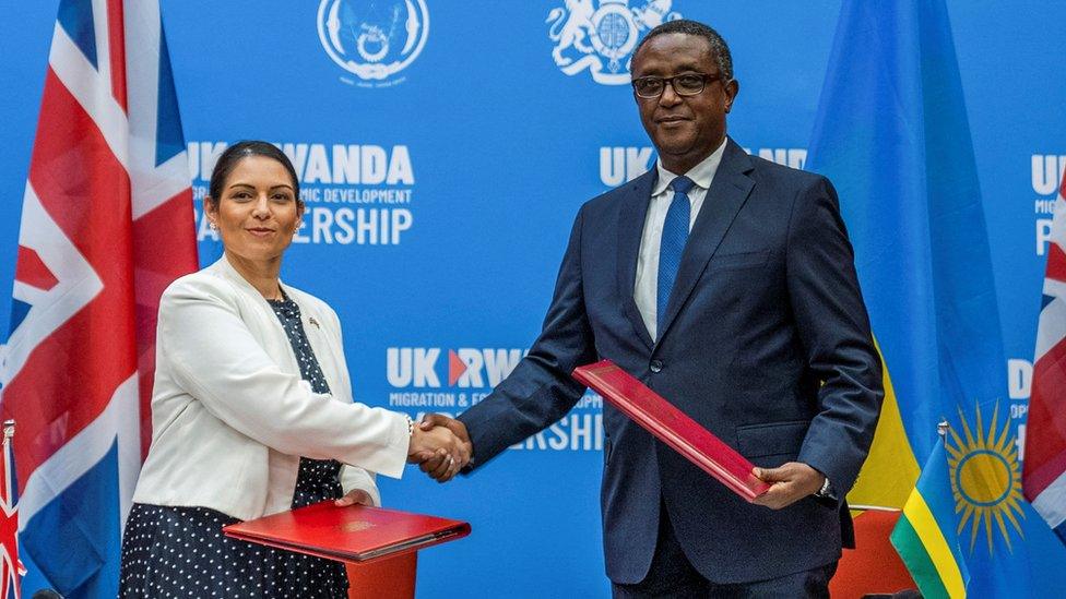 Home Secretary Priti Patel shakes hands with Rwandan Foreign Minister Vincent Birutaare