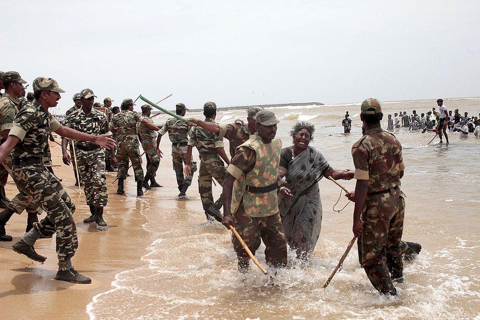 Indian police clash with protestors on the beach at Idinathakarai village near the Kudankulam Nuclear Power Plant in southern Tamil Nadu on September 10, 2012. Police in a southern Indian state shot dead a fisherman and clashed with with activists who were protesting the start of work at a nuclear power plant, officials said.