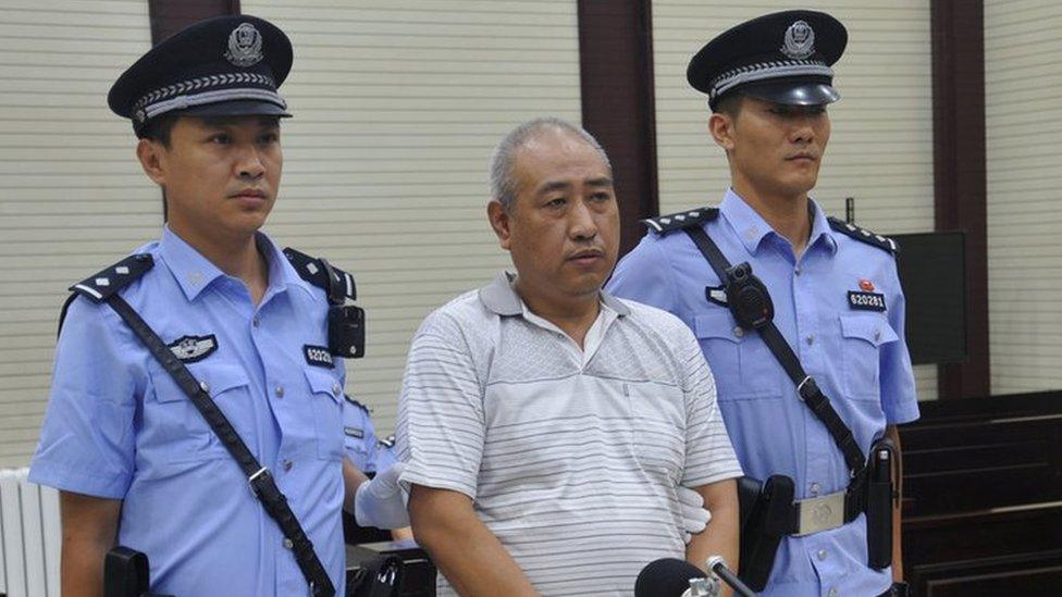 Gao Chengyong attends a trial at the Intermediate People"s Court in Baiyin