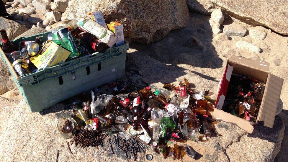 Broken glass and nails on beach