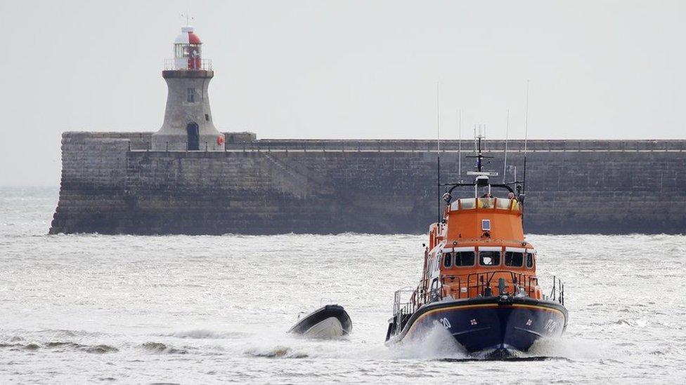 The inflatable boat being brought back to shore