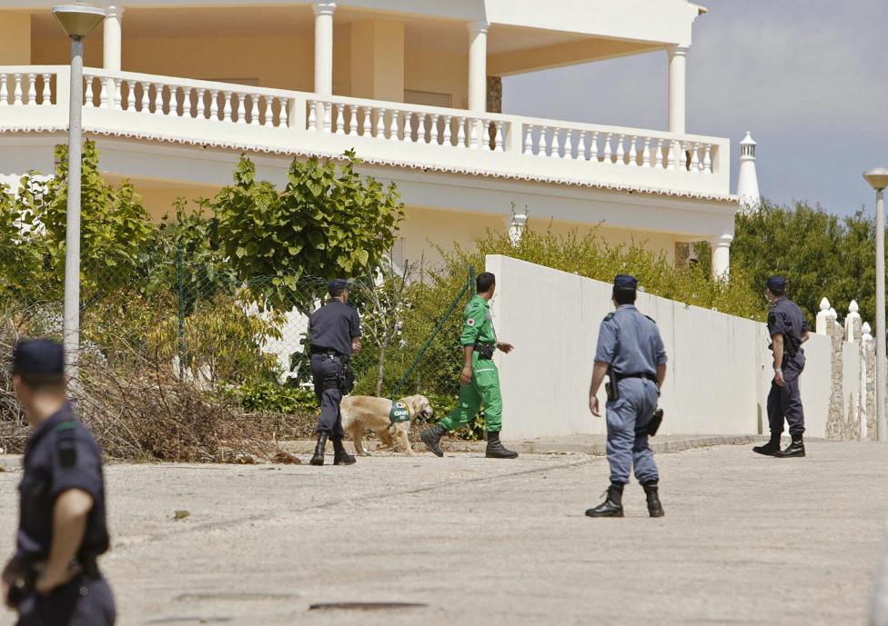 Portuguese police helped by dogs search for Madelaine McCann in front of the Ocean club apartment hotel in Praia de Luz in Lagos on 4 May 2007