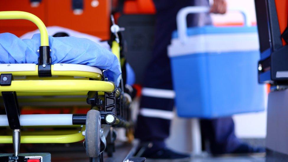 A paramedic transporting an organ donation