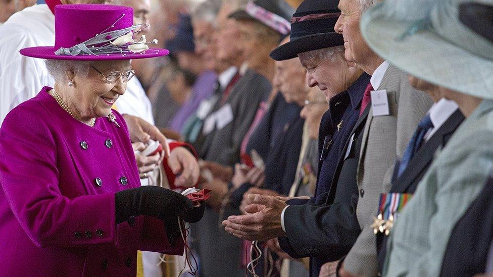 The Queen handing out Maundy coins