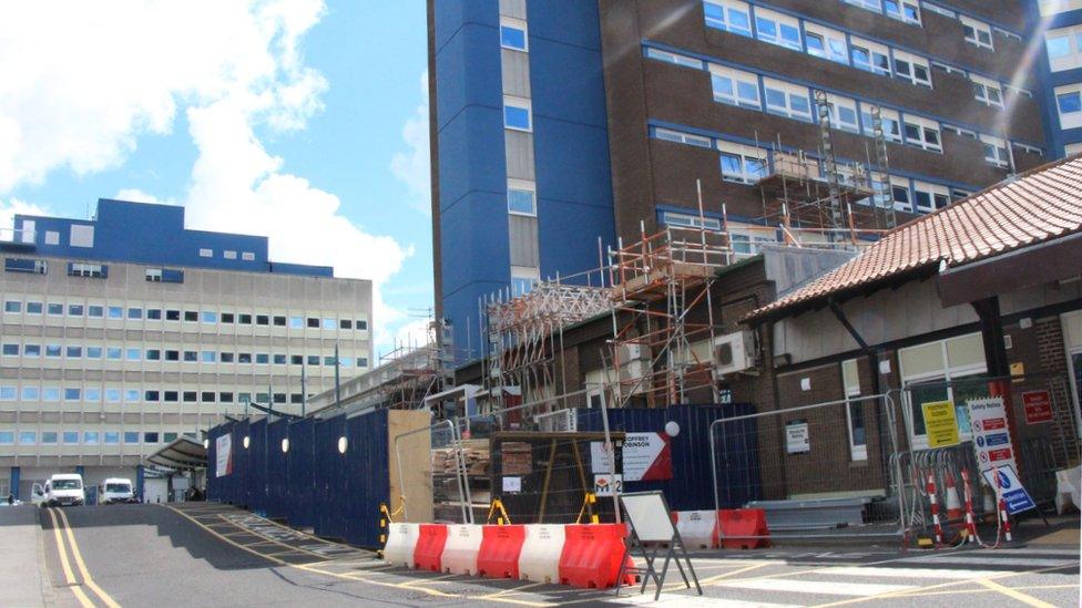 Repair work being carried out to the exterior of the hospital