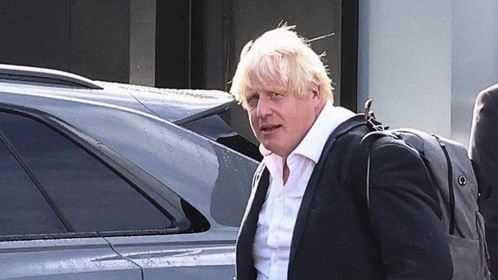 Boris Johnson arriving at Gatwick