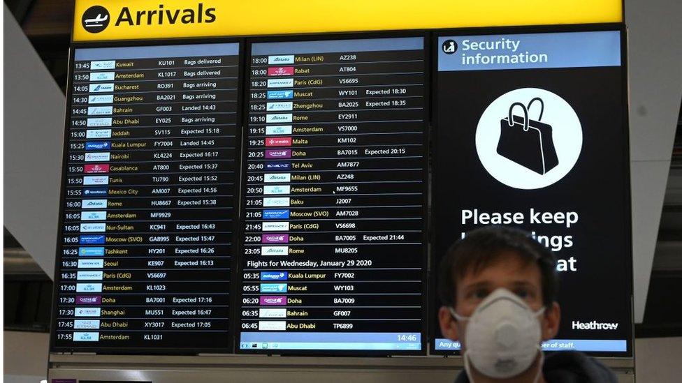 Man wearing mask at Heathrow