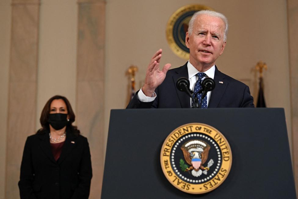 Vice President Kamala Harris listens as US President Joe Biden delivers remarks on the guilty verdict against former policeman Derek Chauvin at the White House in Washington, DC, on 20 April 2021