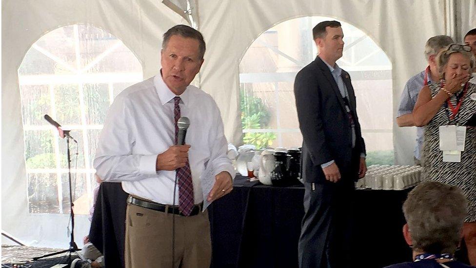 John Kasich addresses delegates in a tent