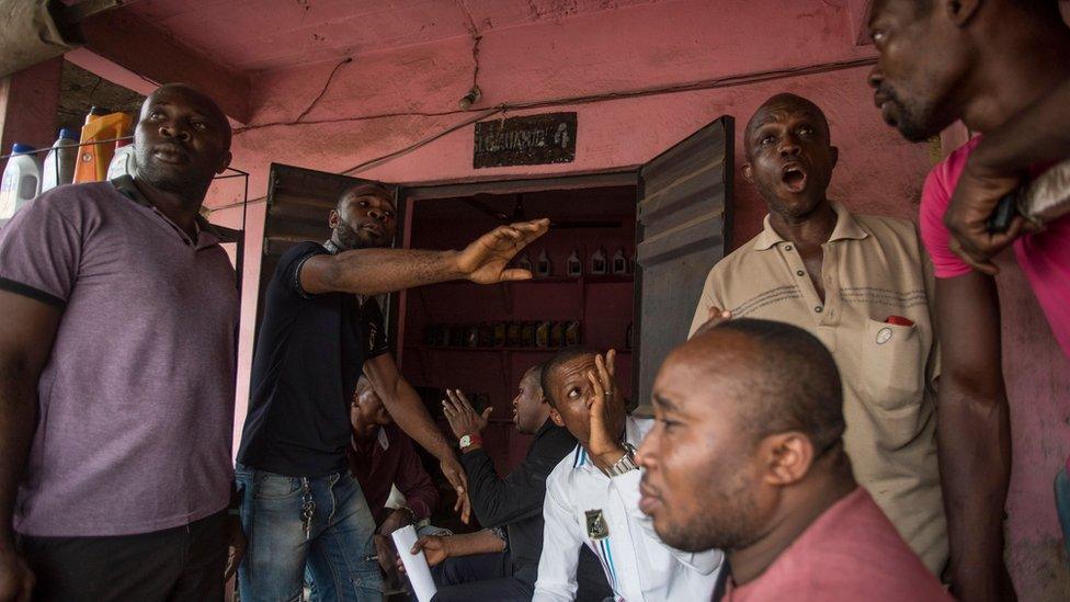 Men discussing the election in Aba, Nigeria - Thursday 14 February 2019