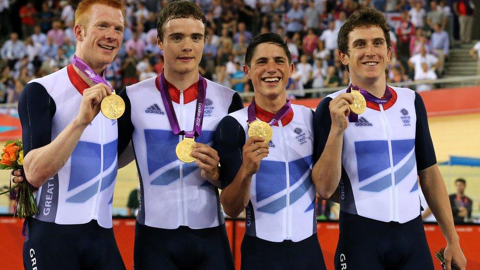 Great Britain"s Ed Clancy (left), Geraint Thomas (right), Steven Burke (second left) and Peter Kennaugh celebrate with their Gold medals in the Men's Team Pursuit Final during day seven of the Olympic Games at the Velodrome, London