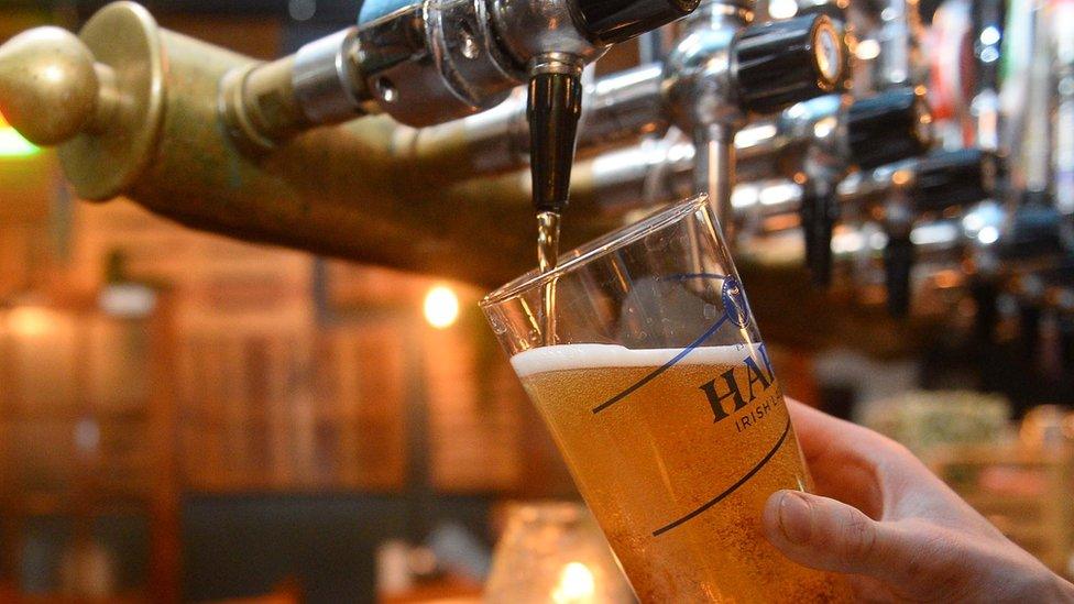 Pint is poured in a pub