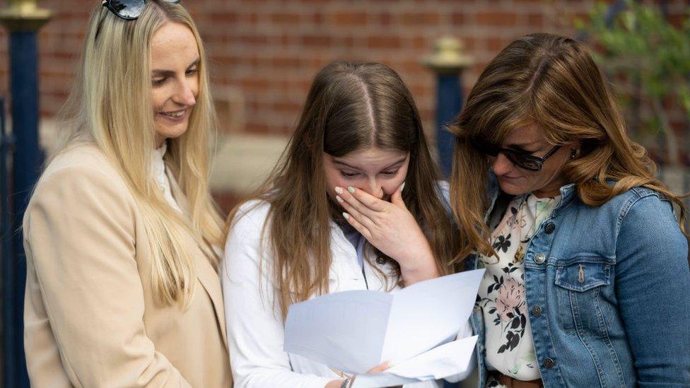 Family opening GCSE results