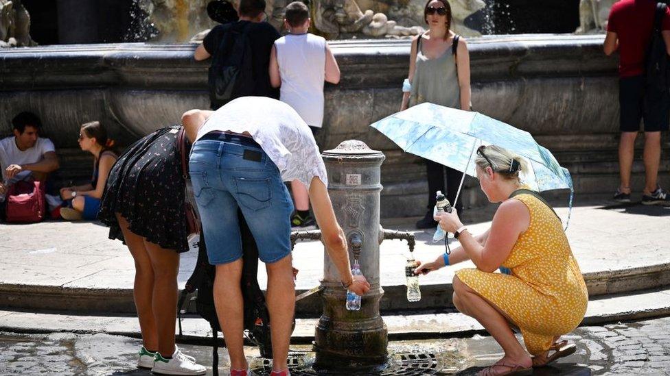 People in Sicily, Italy, try to cool off from the hot temperatures