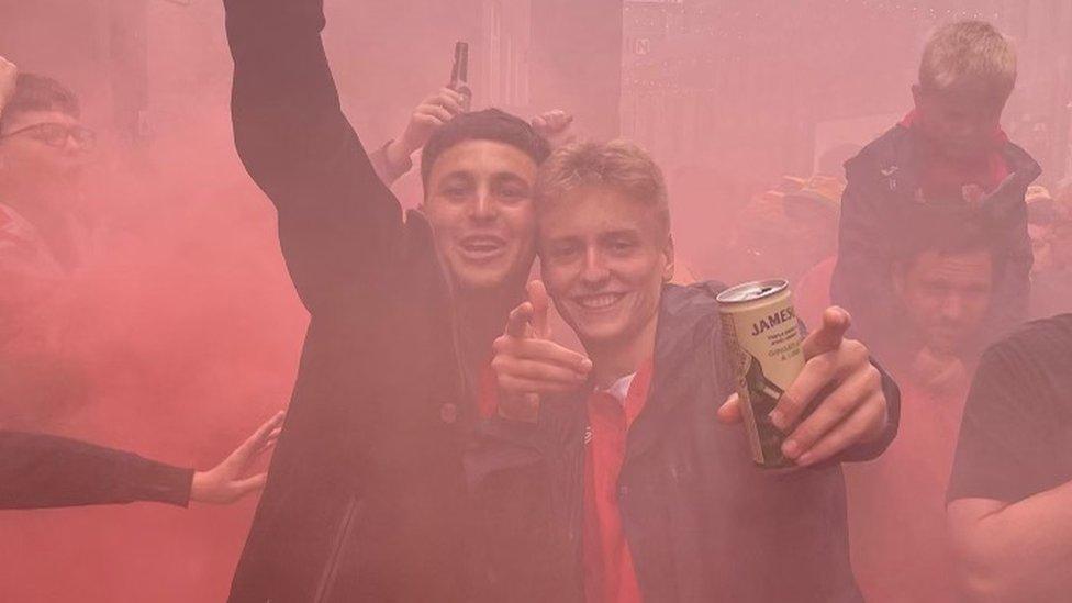 Rhys Thompson (right) with a friend at the game