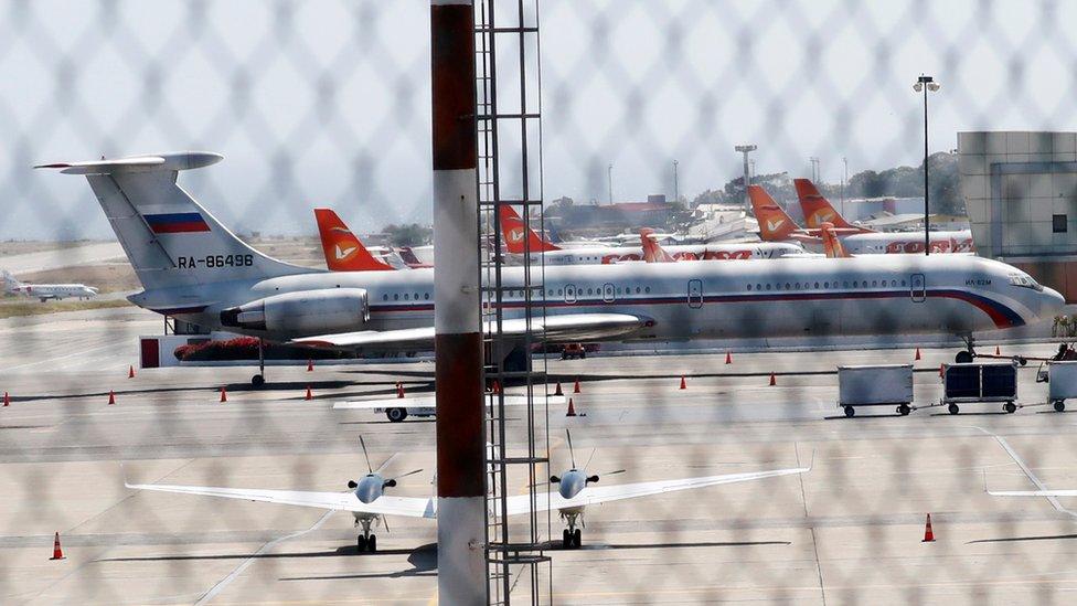 An airplane with the Russian flag is seen at Simon Bolivar International Airport in Caracas,