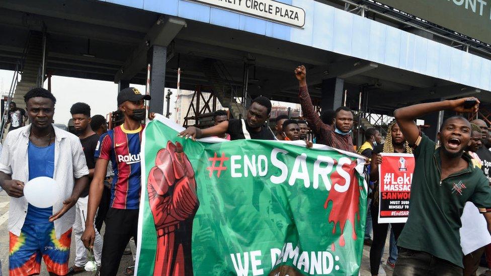 People holding a banner