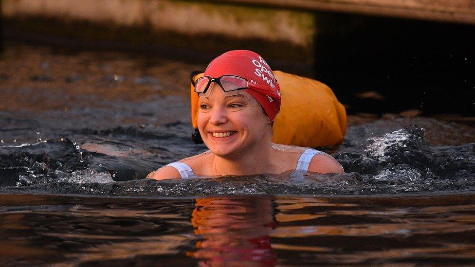 Woman swimming in the West Reservoir Lake in East London