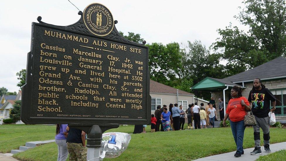 Visitors line up to visit and pay respects the Muhammad Ali Childhood Home Museum on June 4, 2016 in Louisville, KY.