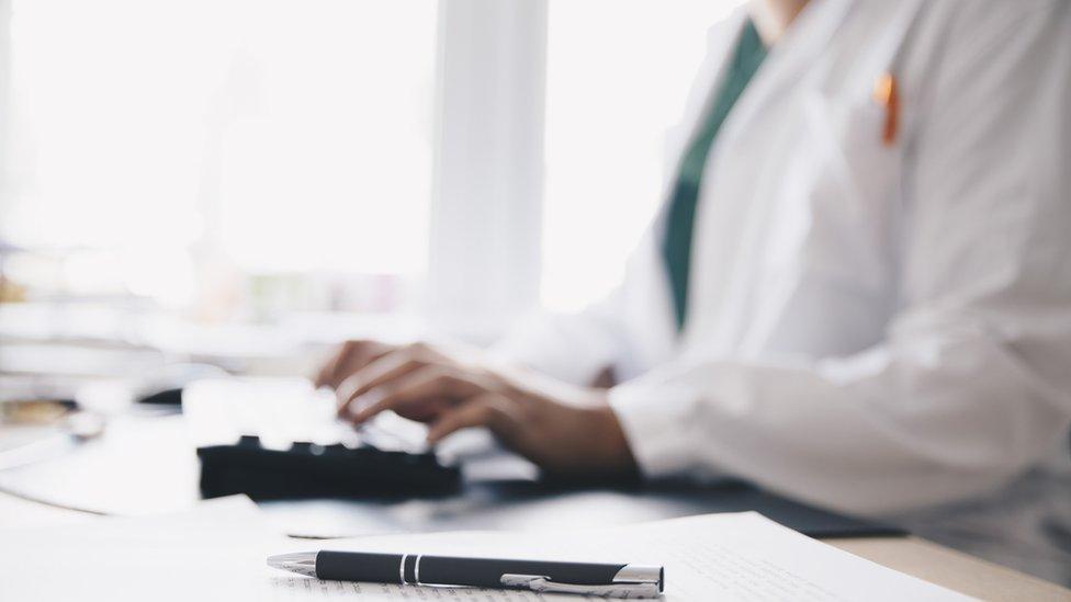 GP in a doctors surgery, stock image