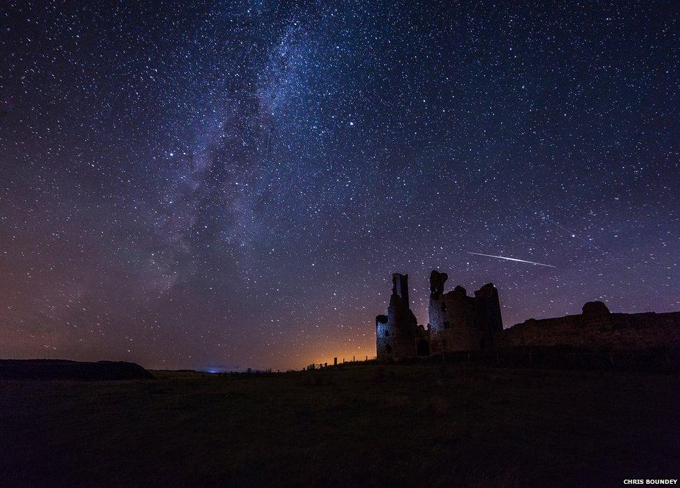 Perseid meteor over Dunstanburgh Castle with the Milky Way also in shot