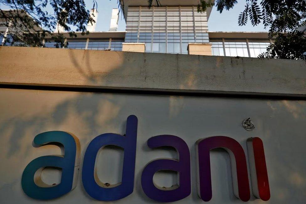 The logo of the Adani Group is seen on the wall of its realty office building on the outskirts of Ahmedabad, India, January 27, 2023