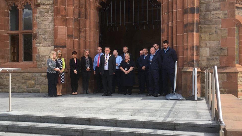 The newly elected mayor of Derry City and Strabane District Council Maoliosa McHugh led a minute's silence in Guildhall Square to the victims