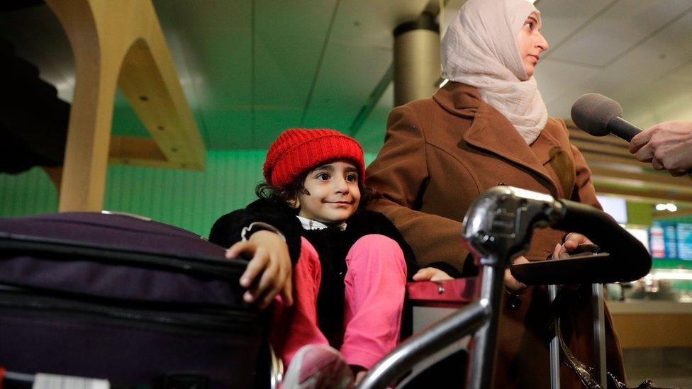 A Yemeni woman and her three year old daughter arrive at Los Angeles International Airport on 8 February, after being stranded due to the travel ban