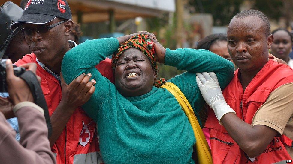 A relative of a victim of the 2015 Garissa college massacre weeps in a Nairobi morgue