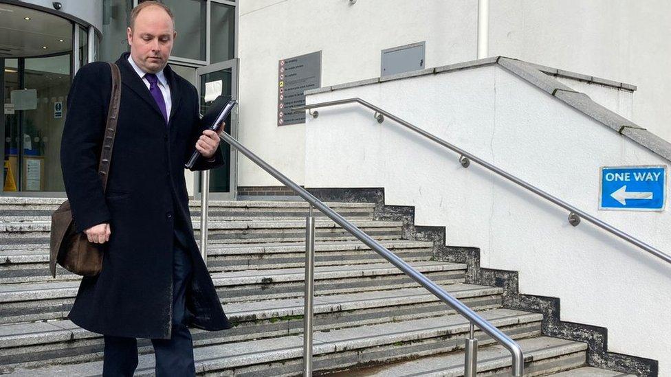 Man walking down court steps