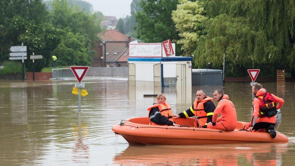 Firefighters in a dinghy in Bruay-la-Buissiere, near Lens, northern France, 31 May