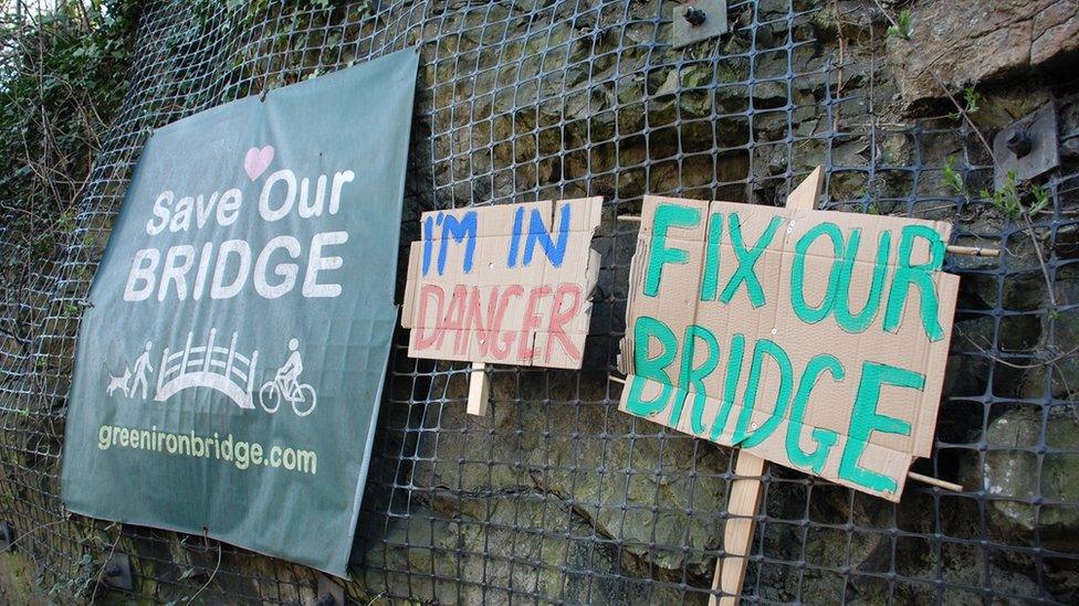 Campaign signs that say 'Save our bridge'