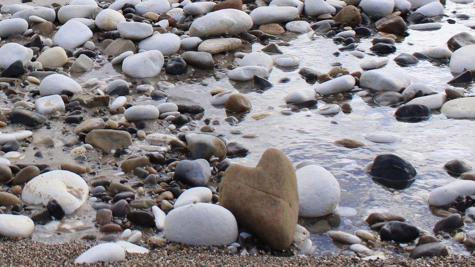 Heart-shaped stone on the beach in Bridlington, East Yorkshire