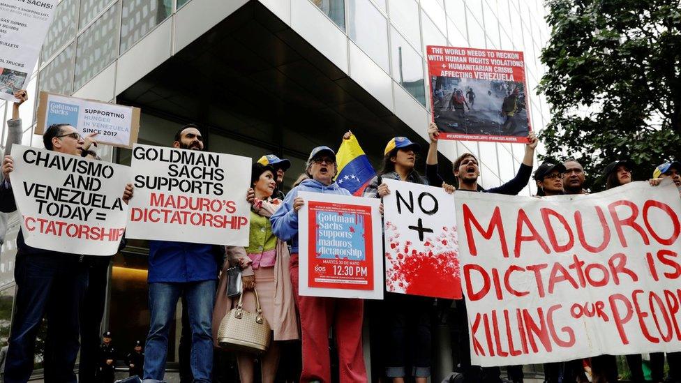 Protesters demonstrate outside Goldman Sachs headquarters in New York, May 30, 2017