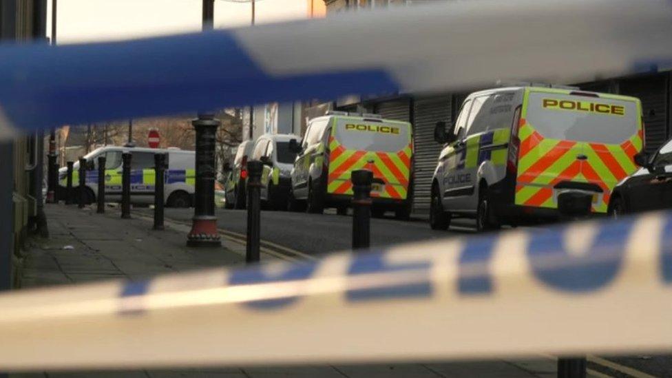 Police vehicles at scene of murder in Batley