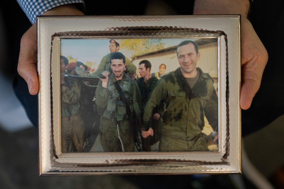 Two of Alan and Judith Sacks' sons in uniform. Both were mobilised after the Hamas attack. (Joel Gunter)