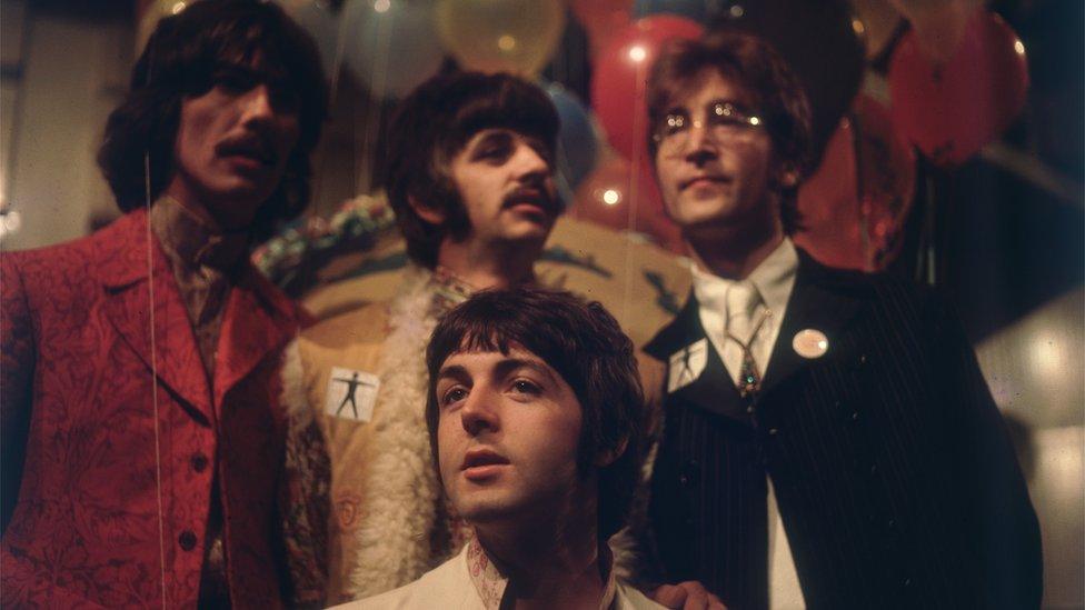 The Beatles at an EMI event in 1967 in different coloured clothing