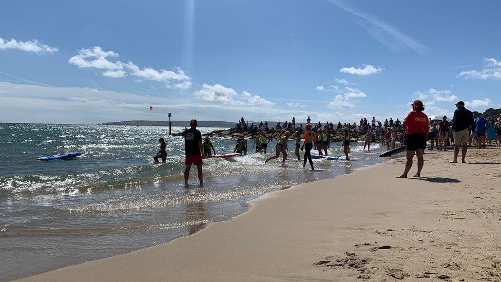 Surfers on beach