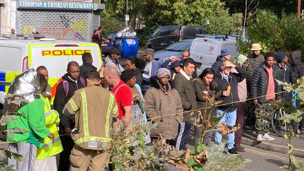 A group of residents after a fire