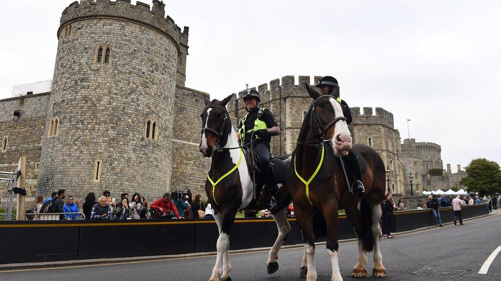 Police on horse back outside Windsor Castle in Windsor