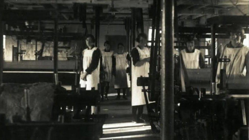 Black and white photograph of part mill workers