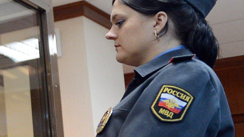 A guard wearing a Russian flag patch during the Pussy Riot trial in 2012