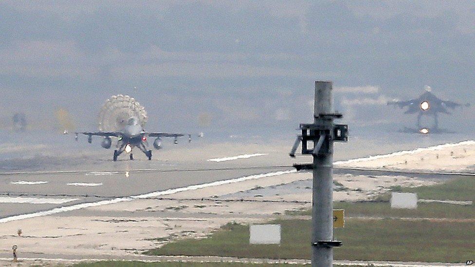 Turkish Air Force fighter planes land at Incirlik Air Base on 30 July 2015