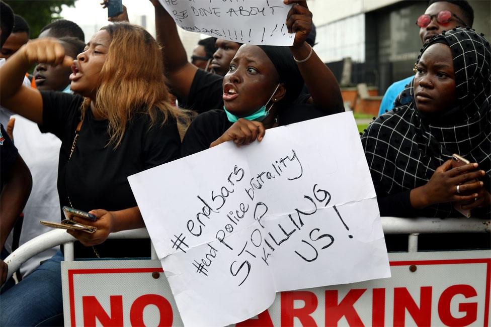 A protester holds a placard