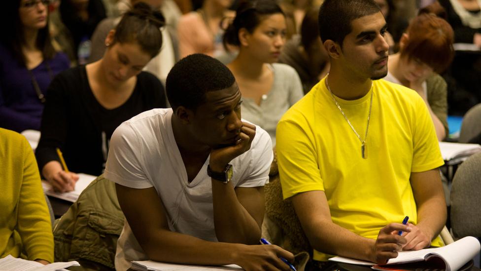 Two students in lecture hall