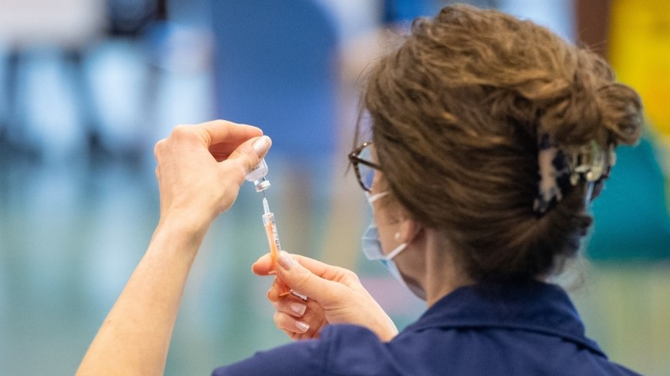 Nurse holding vaccine