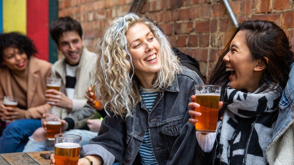 Young people drinking beer