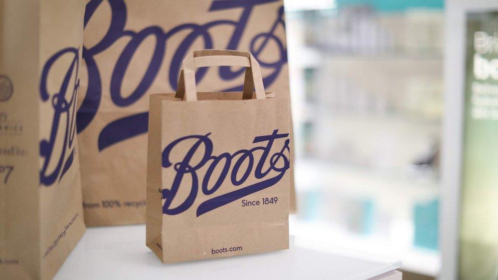 Boots paper bags in a shop