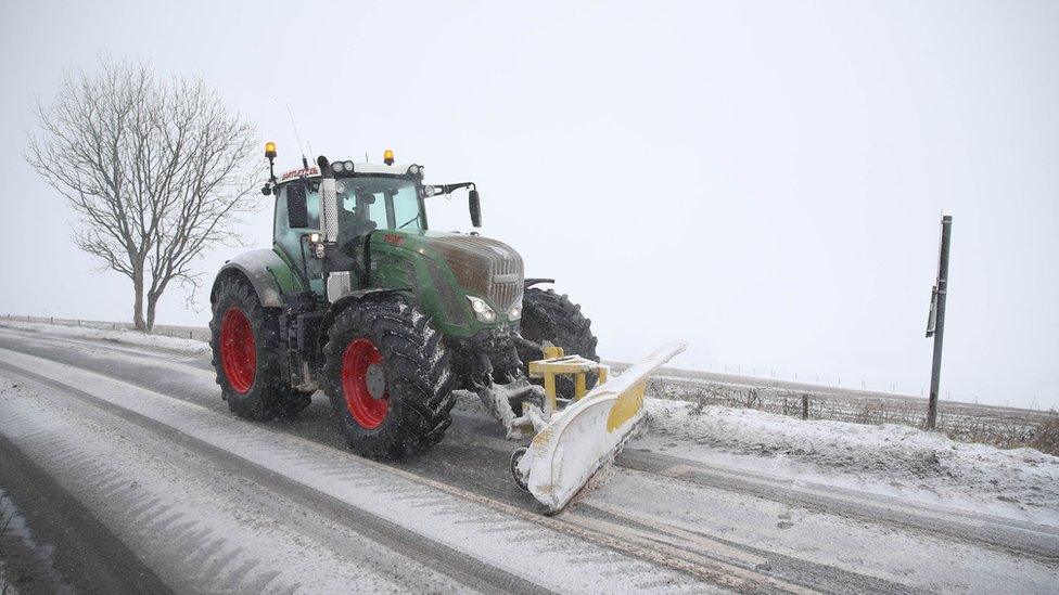 A snow plough clears a road in Shaftesbury, Dorset.