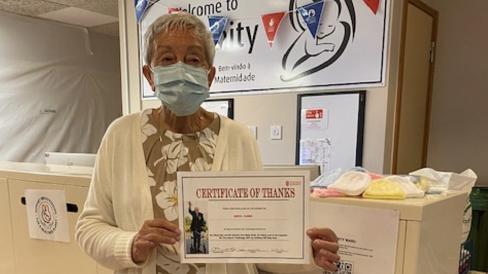 Ms Carre and her certificate